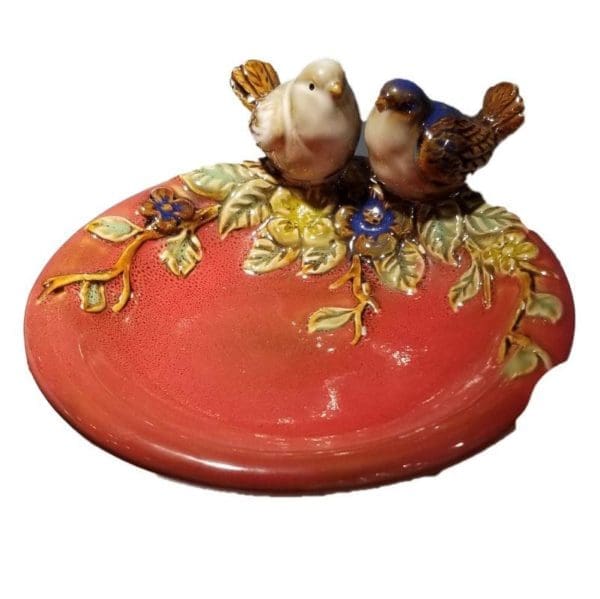 Two Birds Sitting on Top of Trinket (Pan) Dish